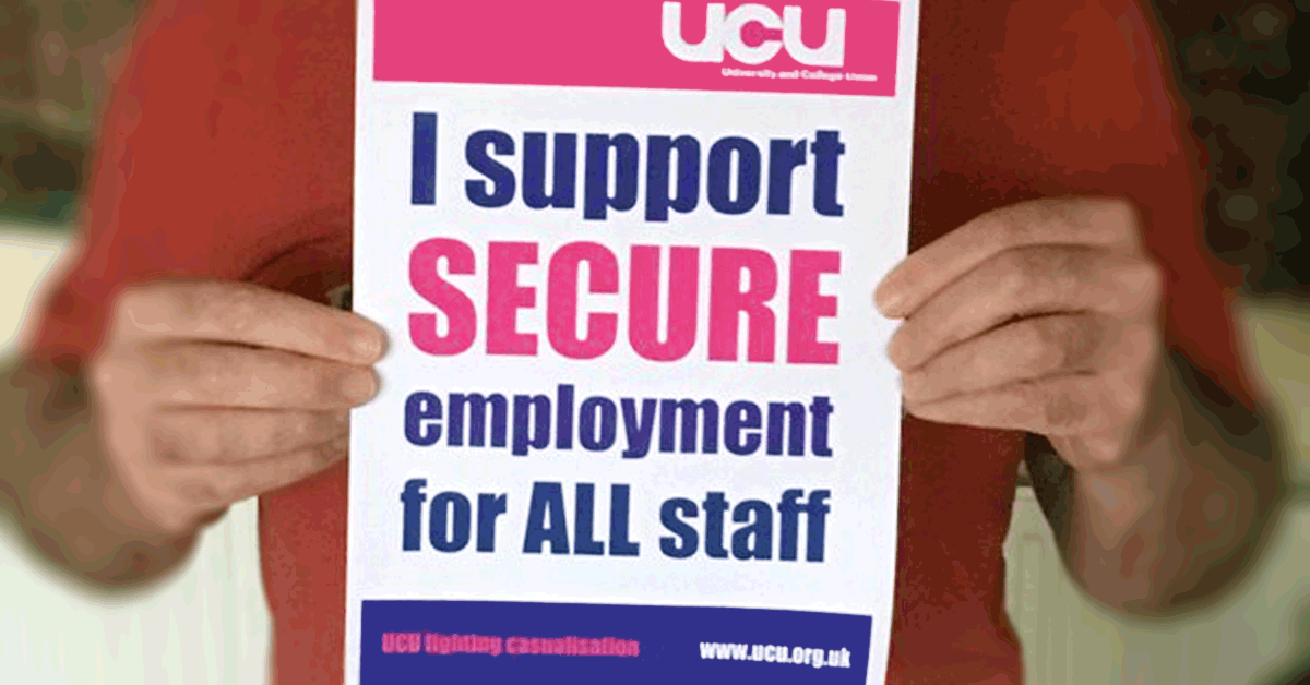 Members holding an 'I support secure employment for all staff' poster